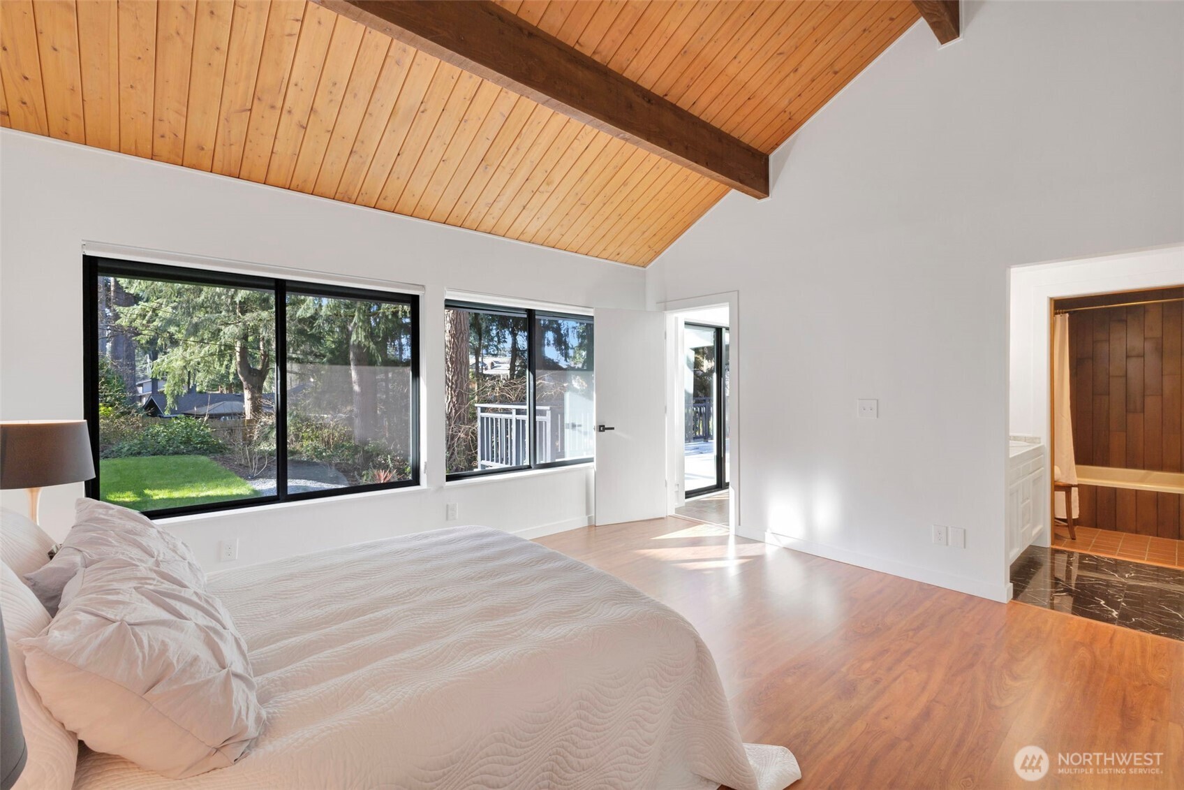 144 Amherst Street Fircrest, WA 98466 - Photo 18 of 39 a bed sitting in a spacious bedroom next to a window