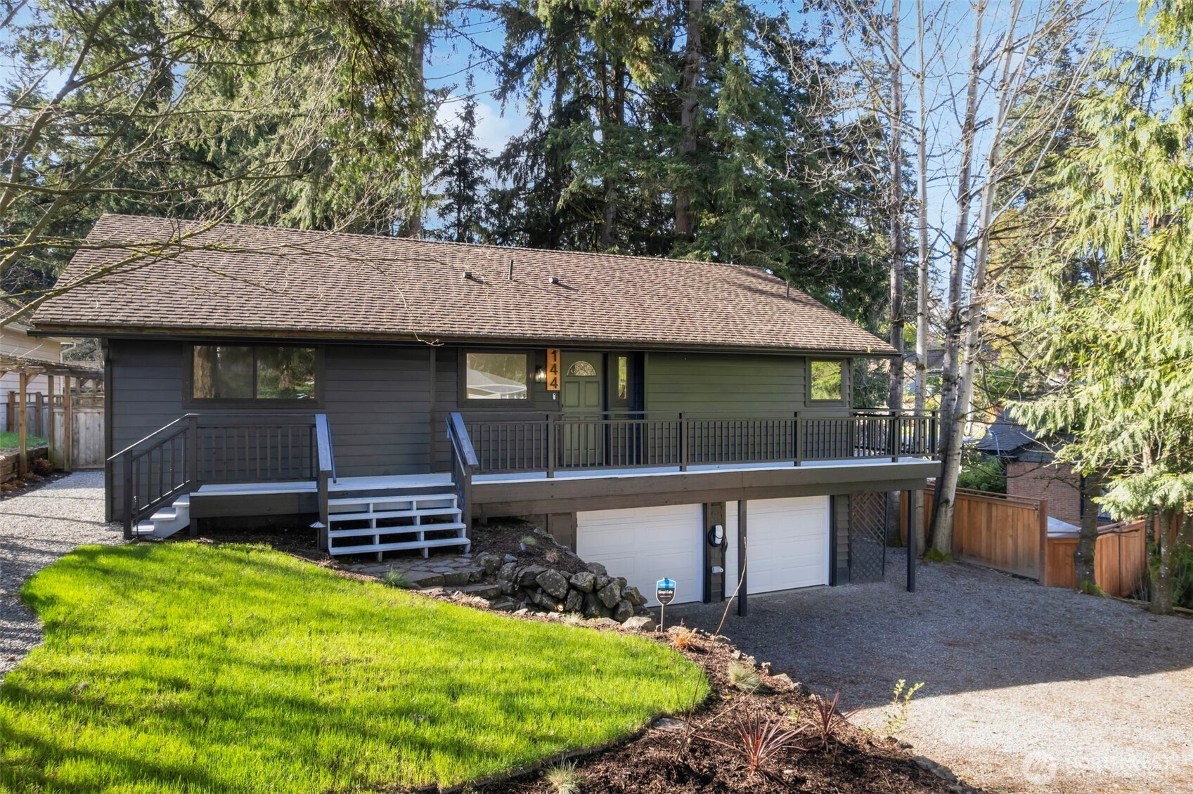 144 Amherst Street Fircrest, WA 98466 - Photo 2 of 39 a view of a house with a yard patio and fire pit