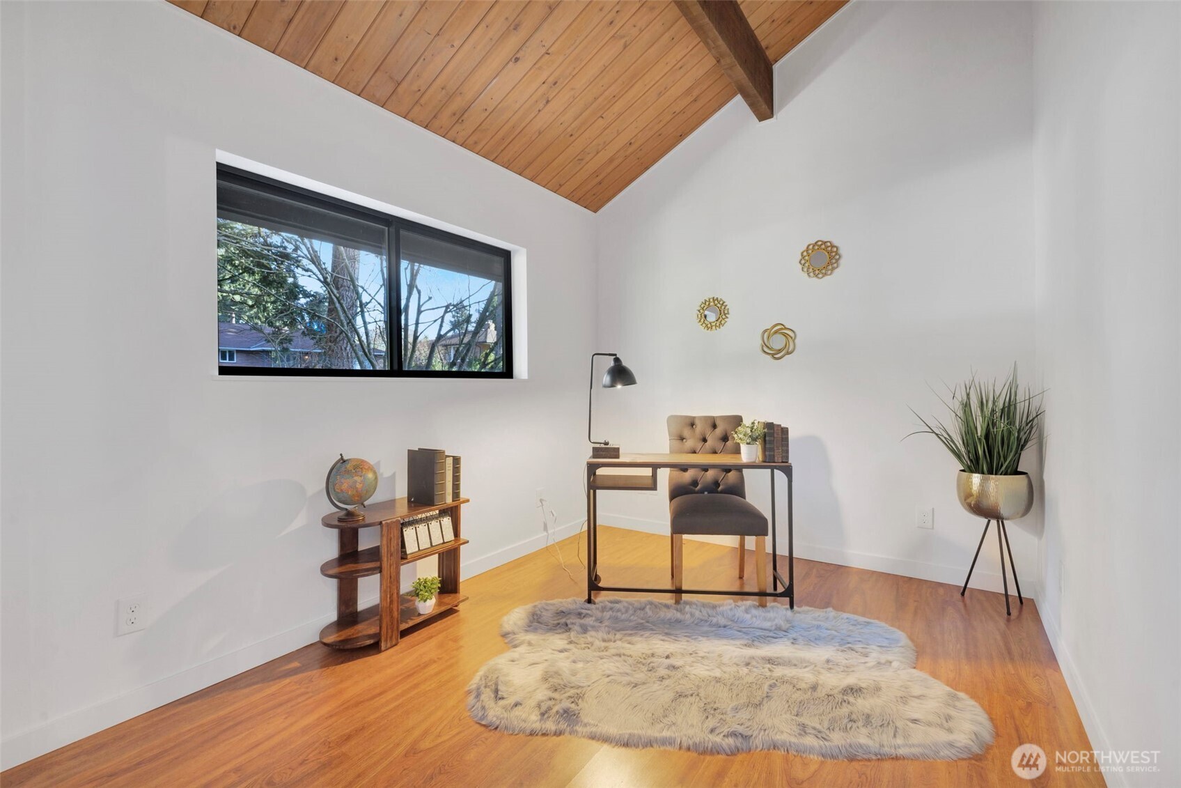 144 Amherst Street Fircrest, WA 98466 - Photo 23 of 39 a living room with furniture and a wooden floor
