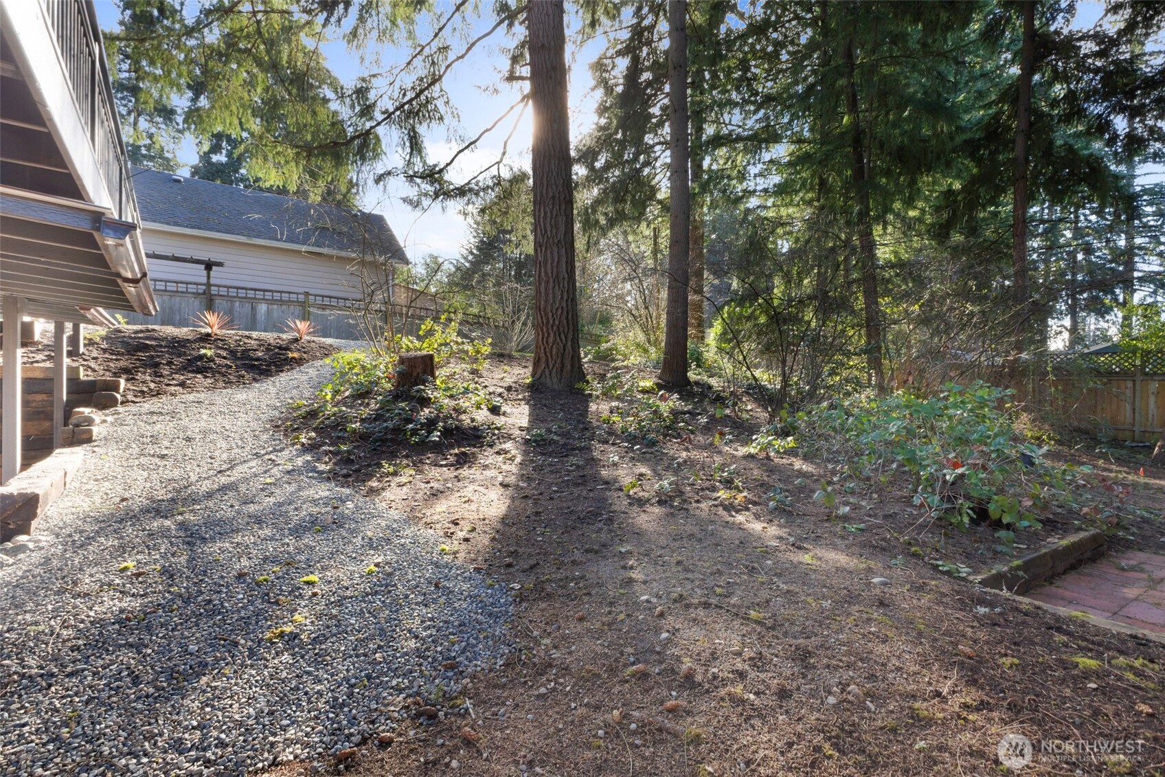 144 Amherst Street Fircrest, WA 98466 - Photo 37 of 39 a view of a house with lots of trees