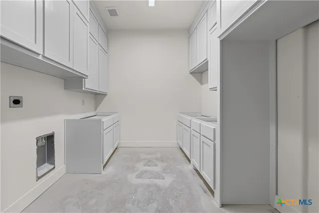 a view of a room with a window and a ceiling fan