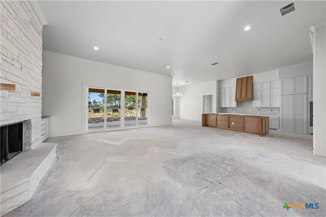 an empty room with fireplace