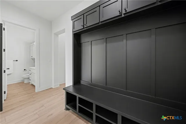 a kitchen with sink cabinets and wooden floor