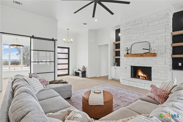 a living room with furniture and a fireplace