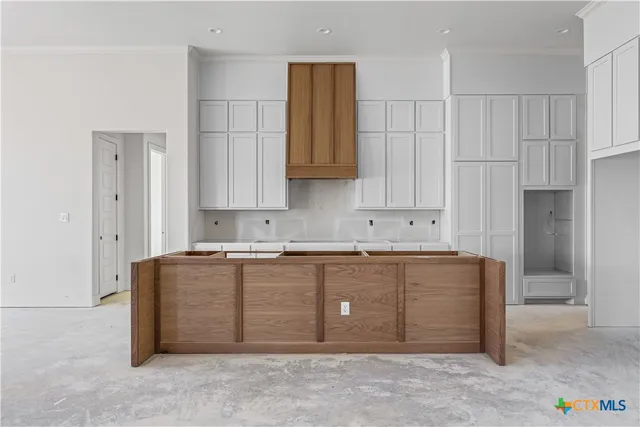 a kitchen that has a sink and a stove in it