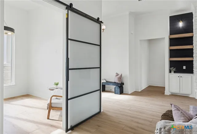 a view of kitchen with furniture and wooden floor