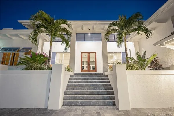 a view of a swimming pool with an outdoor space and seating area