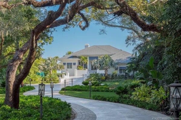 a kitchen with a refrigerator stove top oven and sink
