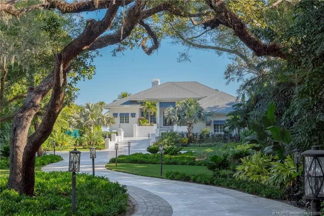a kitchen with a refrigerator stove top oven and sink