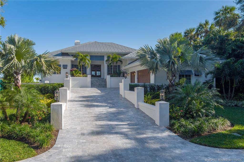 3365 Southeast St Lucie Boulevard Stuart, FL 34997 - Photo 16 of 94 a front view of a house with garden