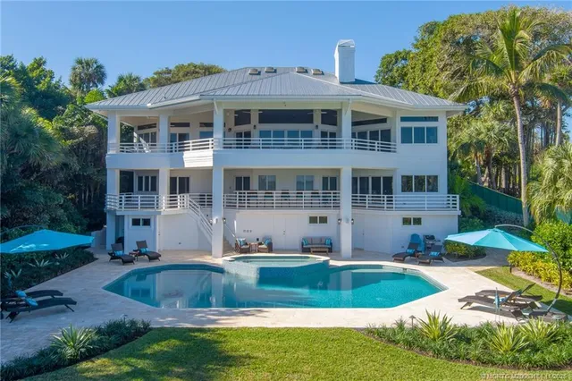 a view of a balcony with furniture