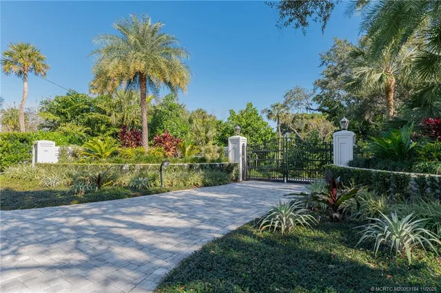 a view of a swimming pool with a couches in a patio