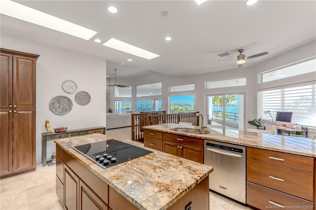 3365 Southeast St Lucie Boulevard Stuart, FL 34997 - Photo 33 of 94 a kitchen with stainless steel appliances granite countertop a stove a sink and a refrigerator
