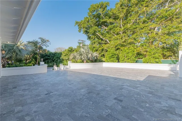 a view of a dining room with furniture and a chandelier