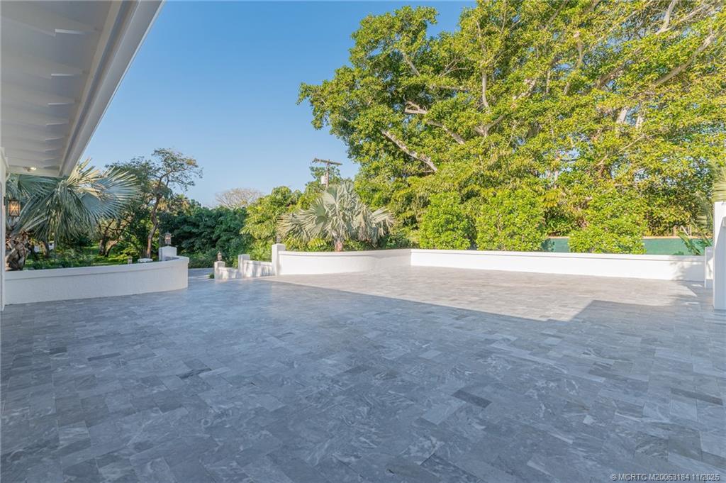 3365 Southeast St Lucie Boulevard Stuart, FL 34997 - Photo 37 of 94 a view of a big yard with plants and trees