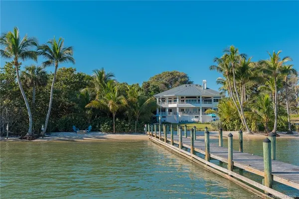 a kitchen with a sink stove and refrigerator
