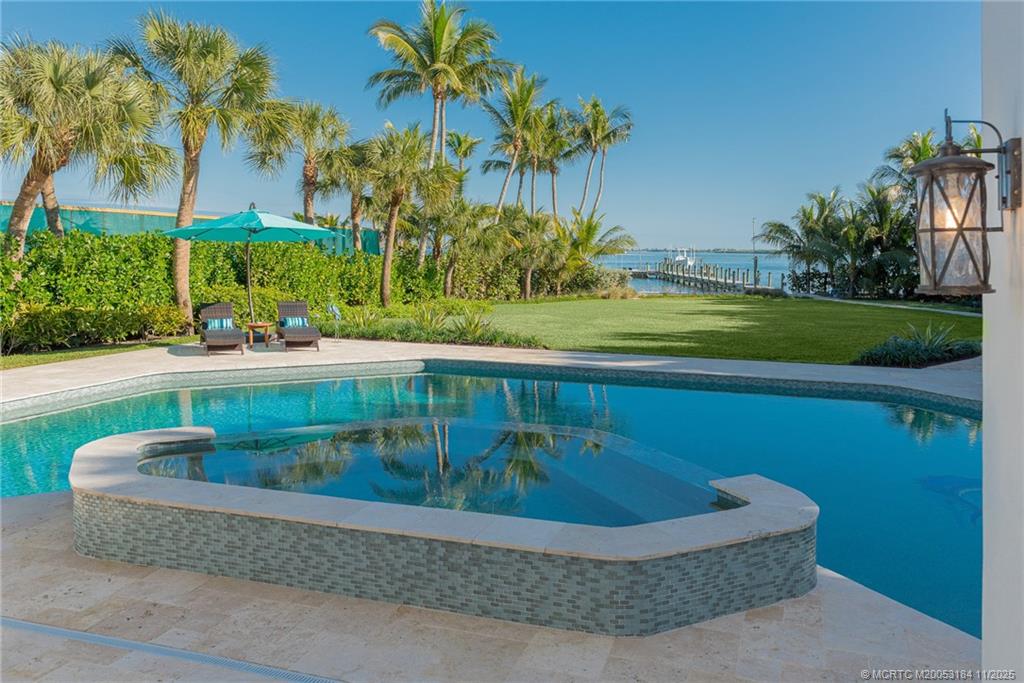3365 Southeast St Lucie Boulevard Stuart, FL 34997 - Photo 47 of 94 a view of outdoor space yard and swimming pool