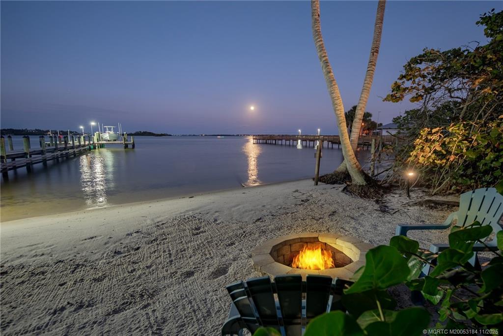3365 Southeast St Lucie Boulevard Stuart, FL 34997 - Photo 6 of 94 a view of a swimming pool with a patio and a yard
