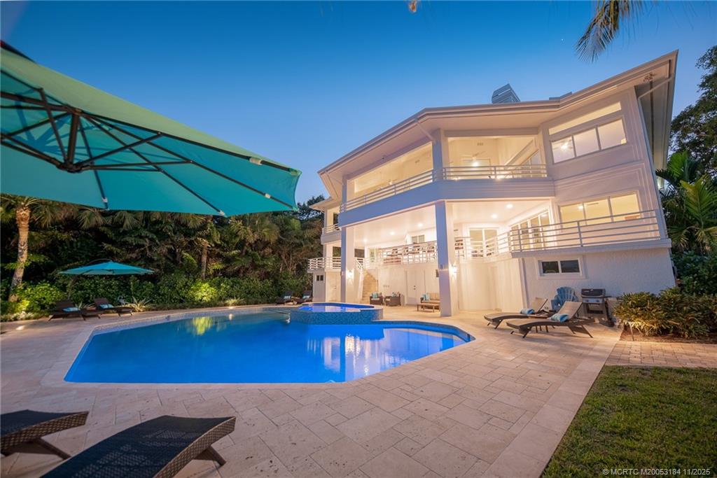 3365 Southeast St Lucie Boulevard Stuart, FL 34997 - Photo 64 of 94 a view of a swimming pool with a patio