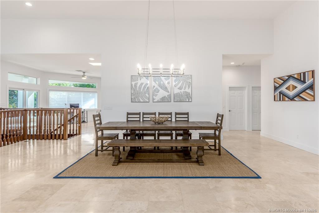 3365 Southeast St Lucie Boulevard Stuart, FL 34997 - Photo 66 of 94 a view of a a dining room with furniture window and wooden floor