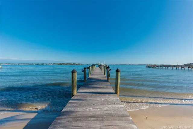an aerial view of a house with outdoor space swimming pool and lake view