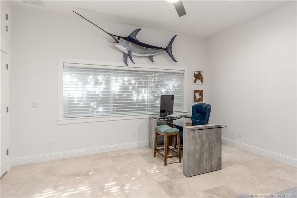 3365 Southeast St Lucie Boulevard Stuart, FL 34997 - Photo 75 of 94 a view of a workspace with furniture and a window