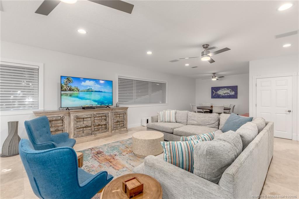 3365 Southeast St Lucie Boulevard Stuart, FL 34997 - Photo 79 of 94 a living room with furniture and a flat screen tv
