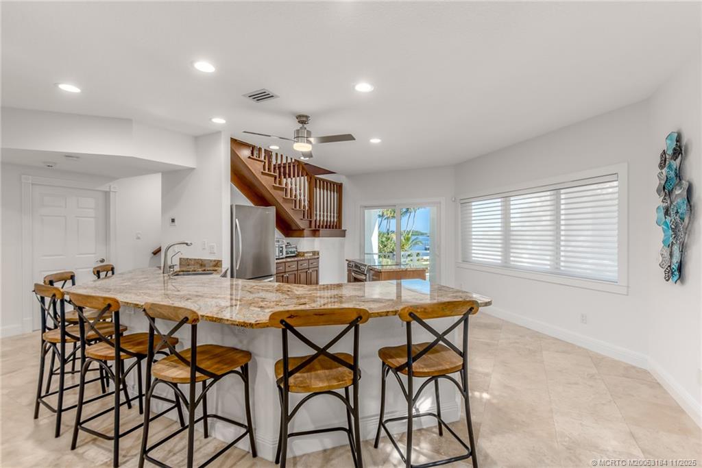 3365 Southeast St Lucie Boulevard Stuart, FL 34997 - Photo 81 of 94 a dining room with furniture and window
