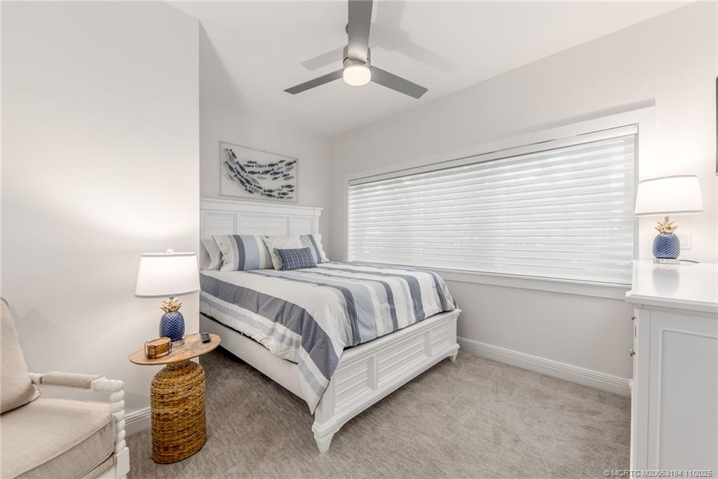 3365 Southeast St Lucie Boulevard Stuart, FL 34997 - Photo 88 of 94 a bedroom with a bed and a window