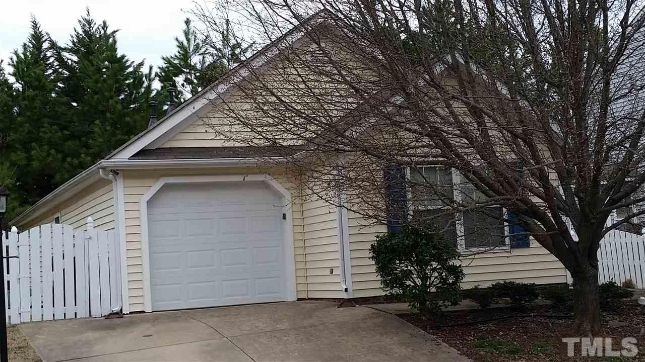 5029 Gable Ridge Drive Durham, NC 27713 - Photo 11 of 11 a front view of a house with a garden