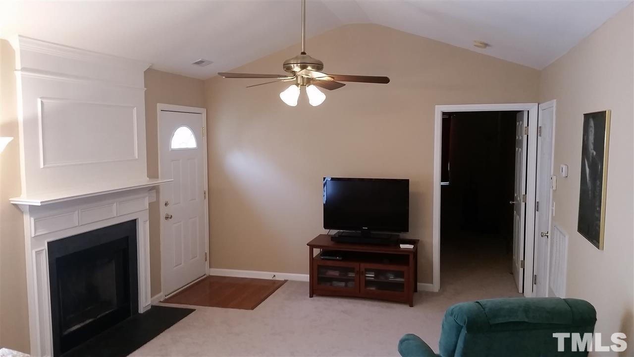 5029 Gable Ridge Drive Durham, NC 27713 - Photo 3 of 11 a living room with furniture and a flat screen tv
