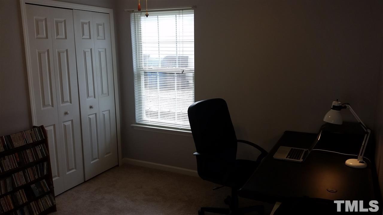 5029 Gable Ridge Drive Durham, NC 27713 - Photo 6 of 11 a view of a workspace with furniture and a window