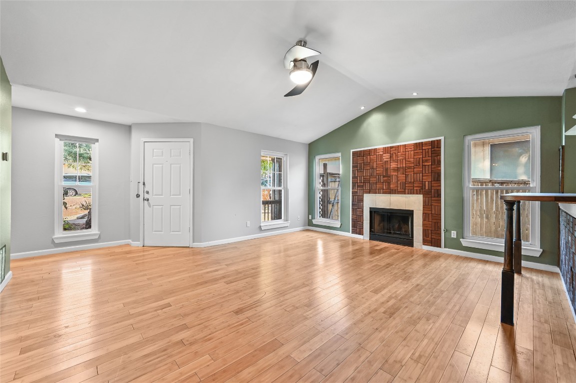 5304 China Berry Road Austin, TX 78744 - Photo 5 of 24 a view of empty room with wooden floor and fan