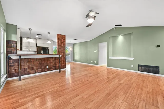 a spacious bathroom with a sink and a mirror