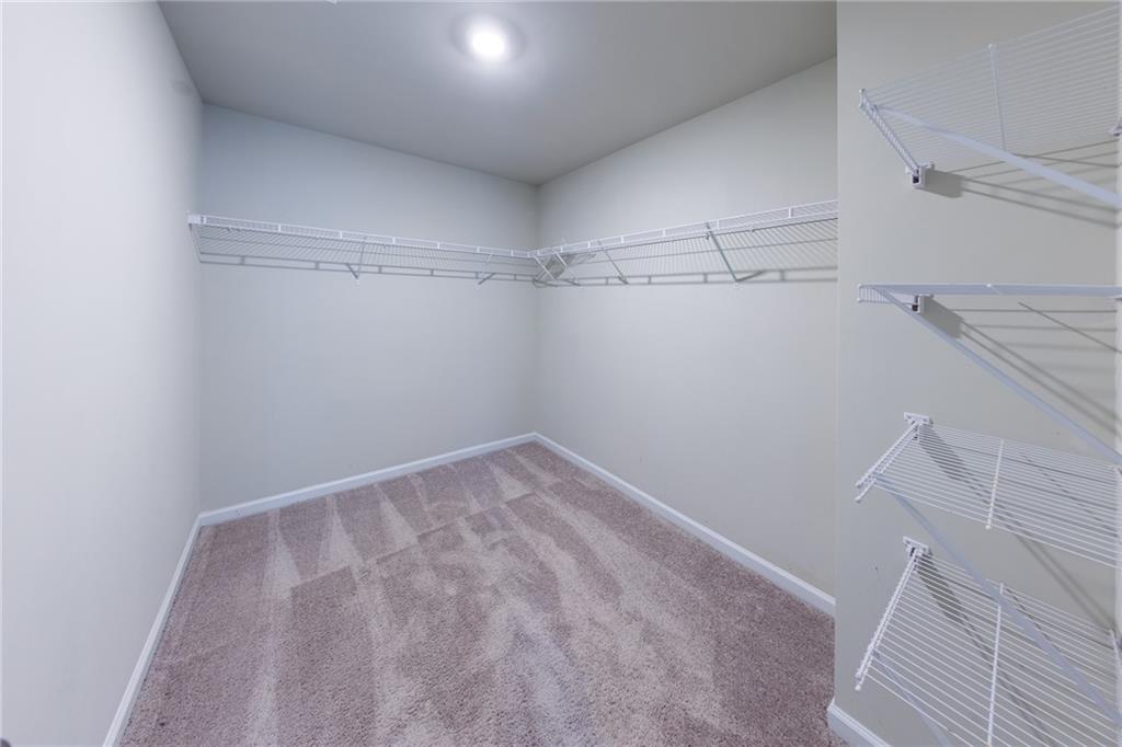 3375 Highbury Way Lithonia, GA 30038 - Photo 14 of 21 a view of a room with racks on the wall