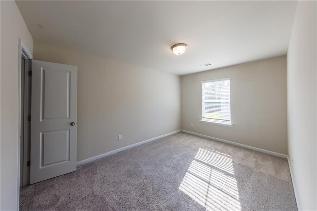 3375 Highbury Way Lithonia, GA 30038 - Photo 15 of 21 an empty room with windows