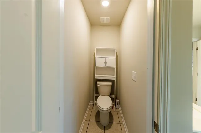 a bathroom with a toilet and a sink
