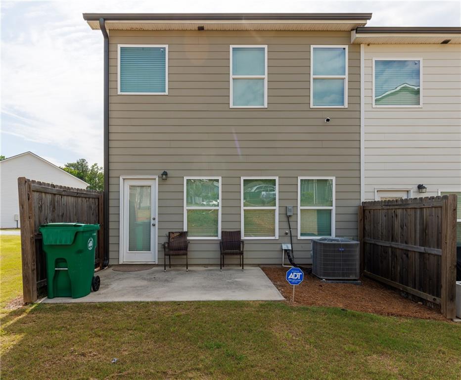 3375 Highbury Way Lithonia, GA 30038 - Photo 21 of 21 a view of a house with backyard and a garden