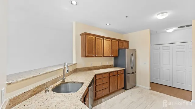 a kitchen with stainless steel appliances a stove microwave and cabinets