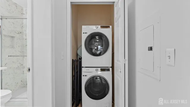 a bathroom with a toilet sink and a mirror