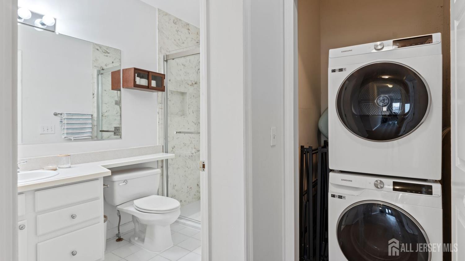 344 The Promenade Edgewater, NJ 07020 - Photo 20 of 44 a bathroom with a toilet sink and a mirror