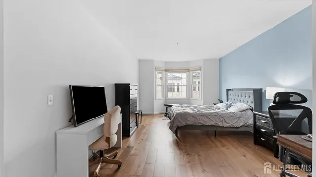 a bed room with bed and tv