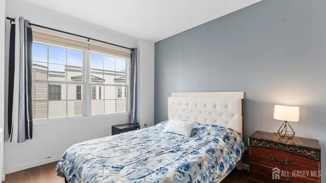 a bathroom with a double vanity sink toilet mirror and bathtub