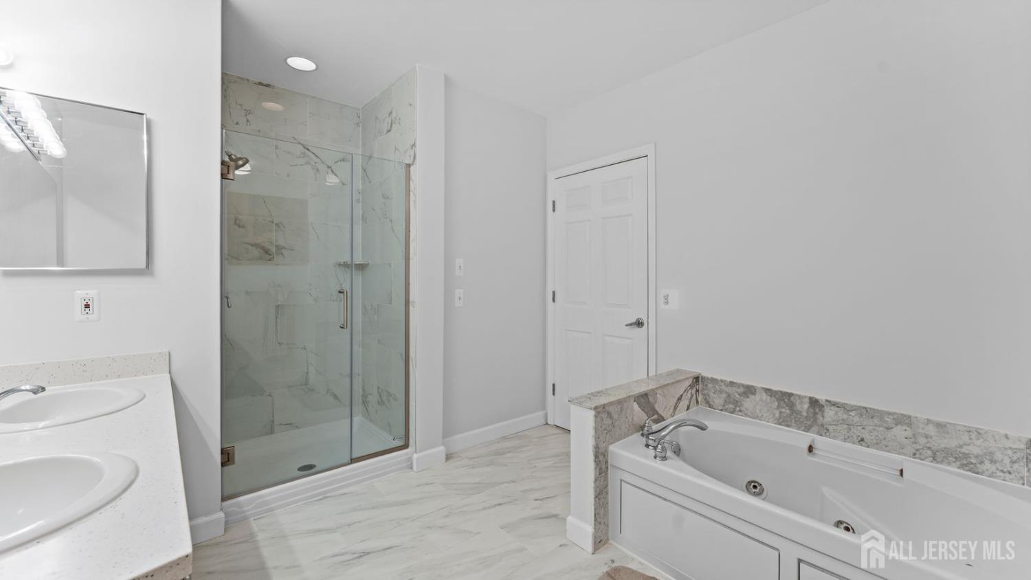 344 The Promenade Edgewater, NJ 07020 - Photo 28 of 44 a bathroom with a sink a toilet and shower