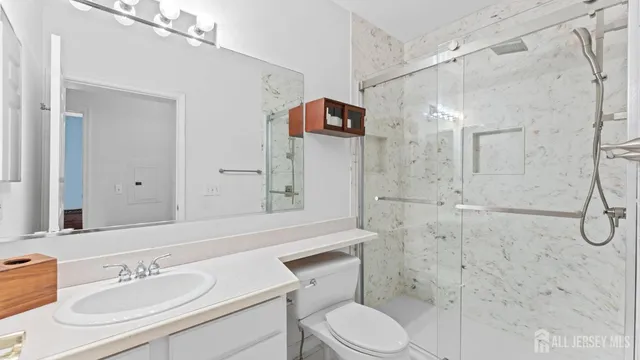 a view of hallway with wooden floor