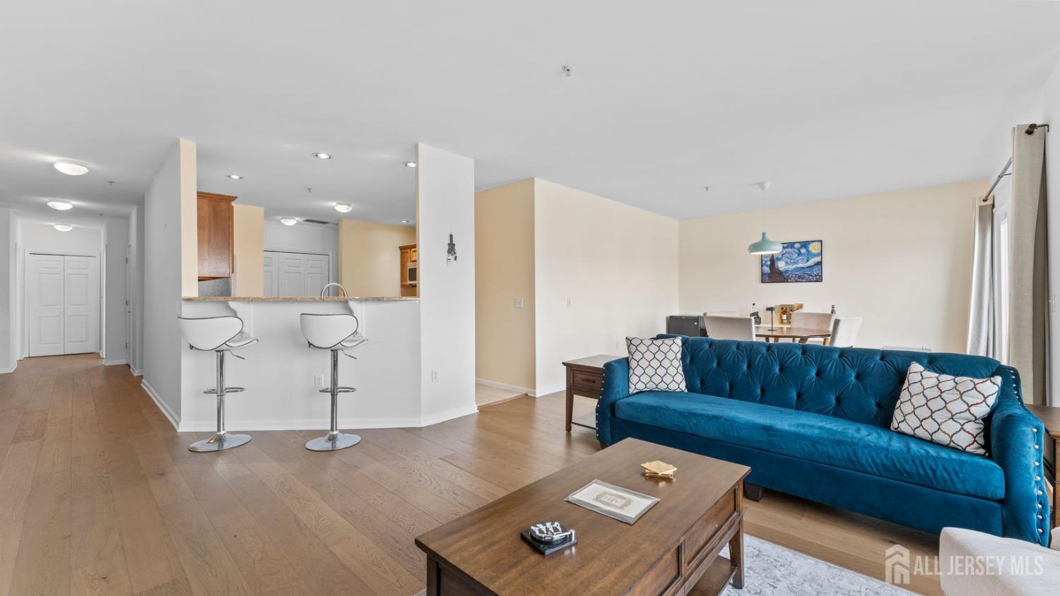 344 The Promenade Edgewater, NJ 07020 - Photo 10 of 44 a living room with furniture and a couch