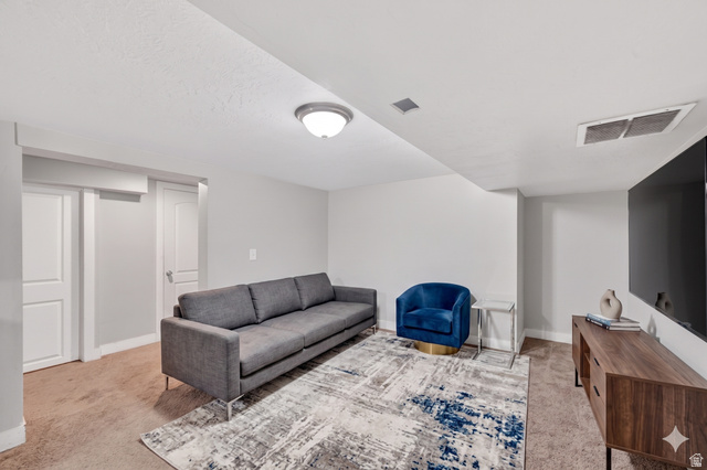 7879 Oak Street Midvale, UT 84047 - Photo 18 of 32 Finished interior space featuring light-colored walls and ceiling, recessed lighting, and carpeted flooring