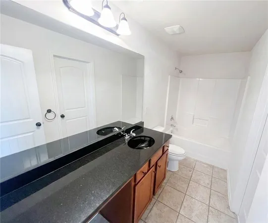 a room with a sink and cabinets