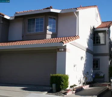 a front view of a house with garage