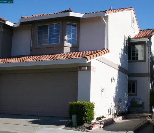 a front view of a house with garage